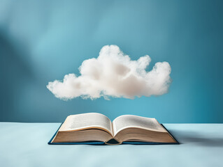 An open book with a cloud above it. The cloud is white and fluffy