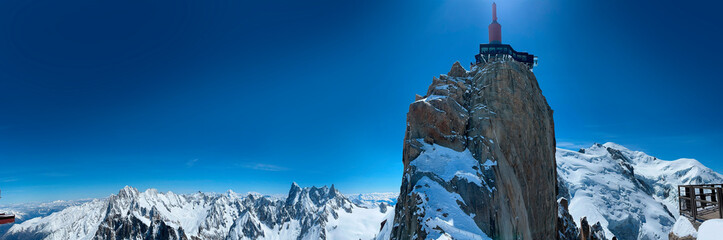 Haute-Savoie, France, 04-25-2024: blue sky and panoramic view of L’Aiguille du Midi (Needle at...