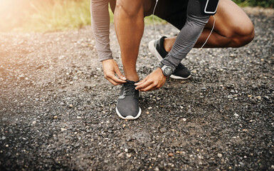 Person, hands and shoelace with exercise or running for fitness, health and wellbeing in outdoor....