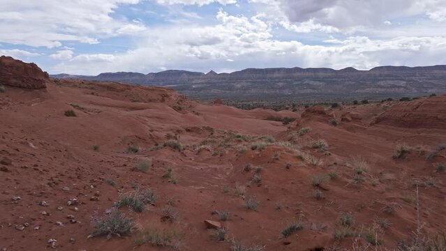 Walking through the Escalante desert viewing the sandstone terrain in Utah.