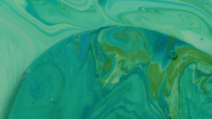 Various colors of paint mixing with mineral oil and dish soap