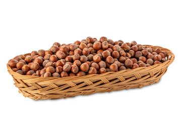 Hazelnuts in wicker basket isolated