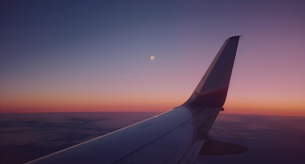 Beautiful Twilight View from Airplane Window with Moon and Wing