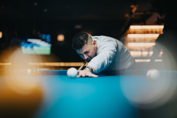 A concentrated individual lines up the cue ball in a dimly lit billiard hall, poised for the shot.