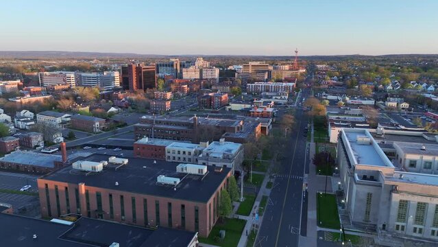 Hartford, Connecticut drone video - Aerial footage looking toward western Hartford and Asylum Hill neighborhood at sunset in late spring