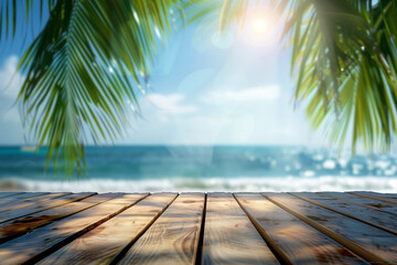 Abstract blurred background of a wooden table top with palm leaves and a blue sea in summer