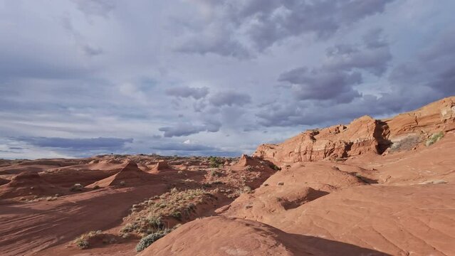Panning view over the Escalante desert as the sandstone glows in the Utah wilderness.