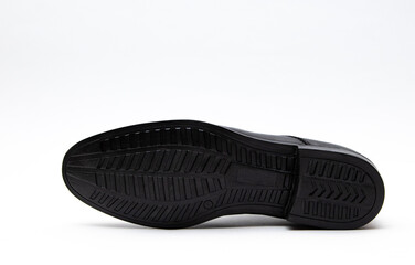 Sole for shoes, bottom view. Black Shoe sole close-up isolated on white background.	
