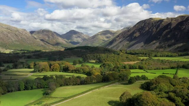 Wastwater and screes NE toward Wasdale Head, Kirk Fell, Great Gable and Scafell Pike. Lake District National Park, Cumbria. Video fly in. Early autumn