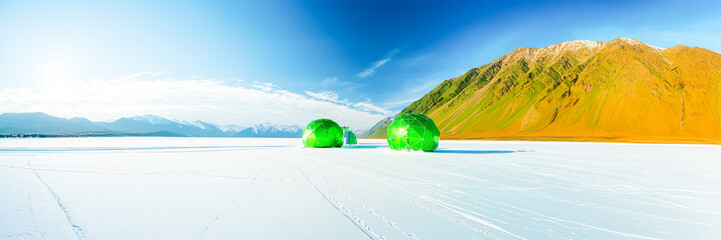 green sphere architecture in ice desert