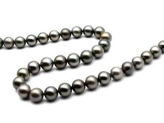 Expensive and luxurious Tahiti black pearls in a stylish necklace on white background, ready to be...