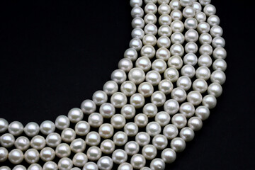 Chinese round freshwater white pearls on strands ready to become a necklace, some of the favorite...