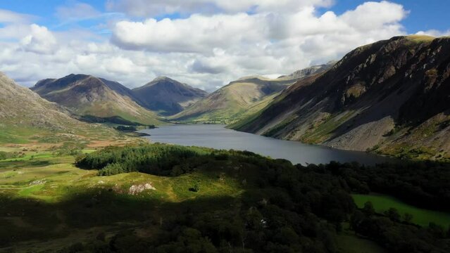 Wastwater and screes NE toward Wasdale Head, Kirk Fell, Great Gable and Scafell Pike. Lake District National Park, Cumbria. Video fly in. Early autumn