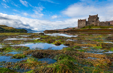 Fototapeta premium Spectacularly sited reconstructed Medieval castle. Sited on an island, connected by a causeway to the mainland at the head of Loch Duich.
