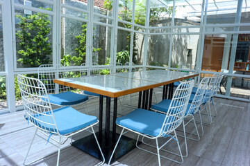 Empty of dining table and chairs of outdoor restaurant or cafe, nature concept