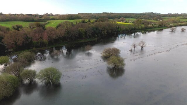 aerial drone photos of Combe Valley Countryside park in Flood and surrounding farmland and lambs in spring	