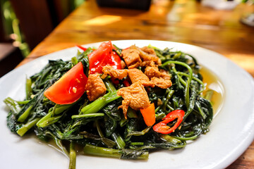 Tumis kangkung, an indonesian food. Stir fried water spinach or morning glory or kale
