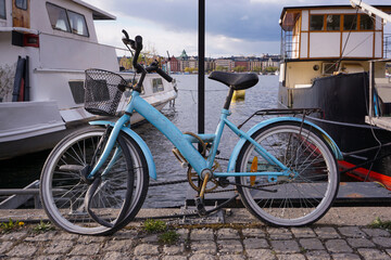Close up of a bicycle parked next to harbor