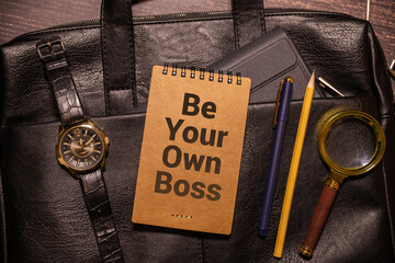Be your own boss words written on ripped paper piece with red background.