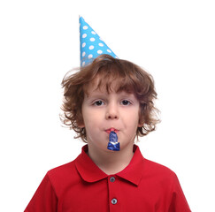 Cute little boy in party hat with blower on white background