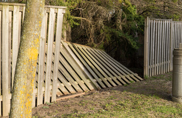 Damaged section of a wooden picket fence - shot on an angle