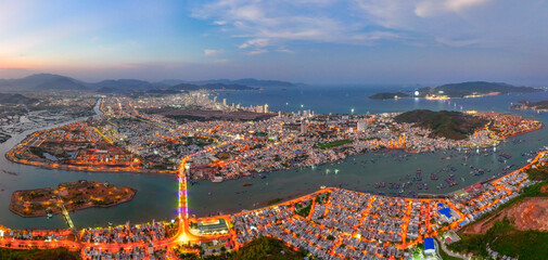 Nha Trang coastal city at night, with the famous and beautiful beaches and bays in Vietnam.
