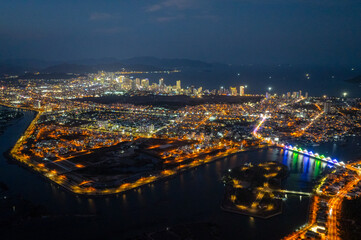 Nha Trang coastal city at night, with the famous and beautiful beaches and bays in Vietnam.
