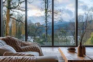 Scenic Views: Minimalist Interior with Large Windows, Chunky Knit Throw, and Wooden Table Centerpiece