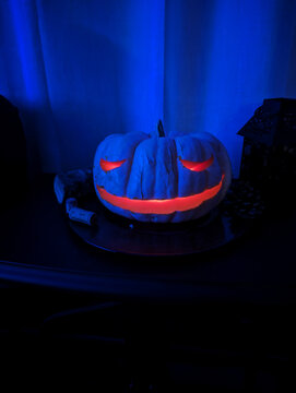 Halloween pumpkin on dark blue background