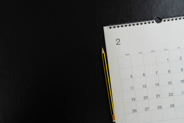 close up of calendar on the black table background, planning for business meeting or travel...