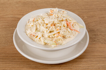 A small dish of coleslaw in a restaurant