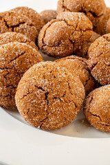 Warm Homemade Gingersnap Cookies on a light background in a plate