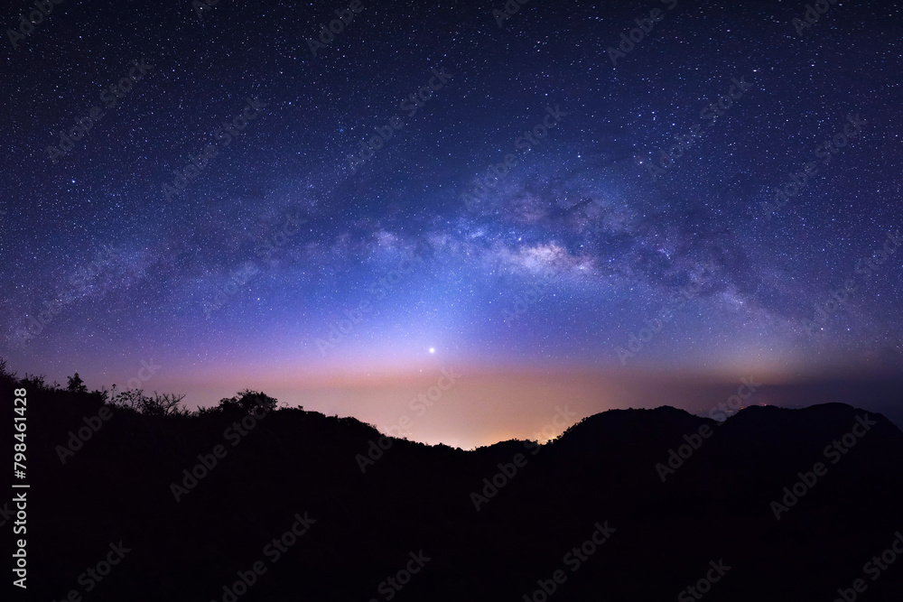 Wall mural landscape silhouette tree on high moutain before sunrise with milky way galaxy