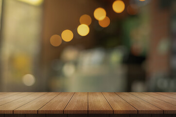 Empty wooden table top with lights bokeh on blur restaurant background.