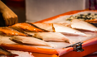 a stall brimming with a variety of fresh fish