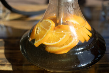 Orange in hookah. Smoking through orange. Glass hookah.