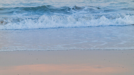The gentle lap of the rolling wave