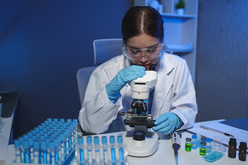 Medical development laboratory, scientists look under the microscope. Analysis of petri dishes,...