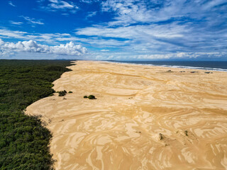 Walk through the sand dunes to Tin City