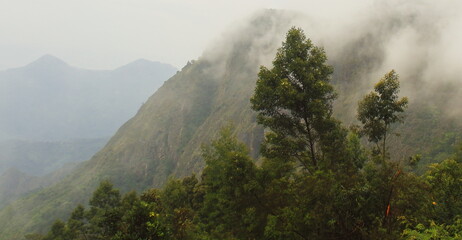 monsoon clouds gathering over palani hills, part of western ghats mountains range, wildernessn of...