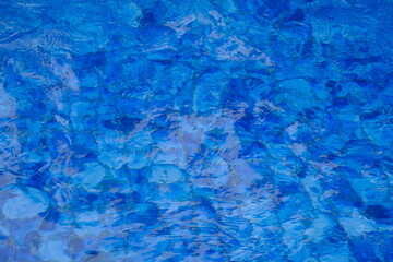 The surface of water is blue with ripples. water