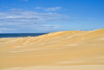 Walk through the sand dunes to Tin City