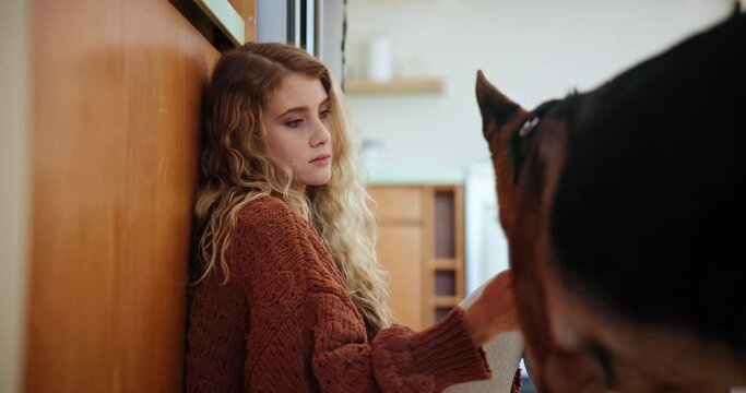 Home, woman and dog with love, sad and playing with depression or best friend in kitchen. Apartment, girl and therapy pet with trust and wellness with care and companion with emotional support animal