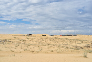 Walk through the sand dunes to Tin City