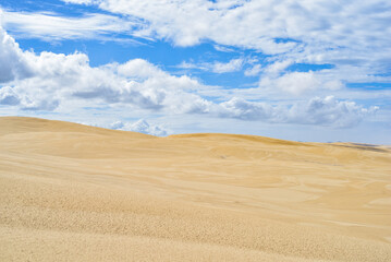 Walk through the sand dunes to Tin City