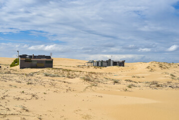 Walk through the sand dunes to Tin City