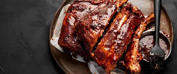 Grilled and smoked ribs with barbeque sauce.