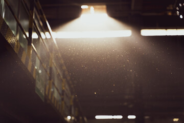 Strong Sun Rays Filtering Through a Textile Factory Interior