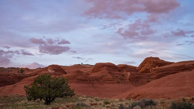 Timelapse looking through the Escalante desert during sunset as clouds move through the sky.