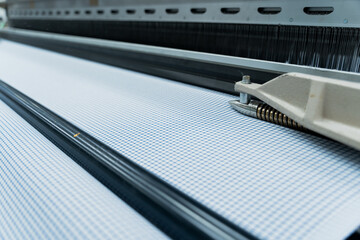 Close-Up of Weaving Machine in Textile Factory


